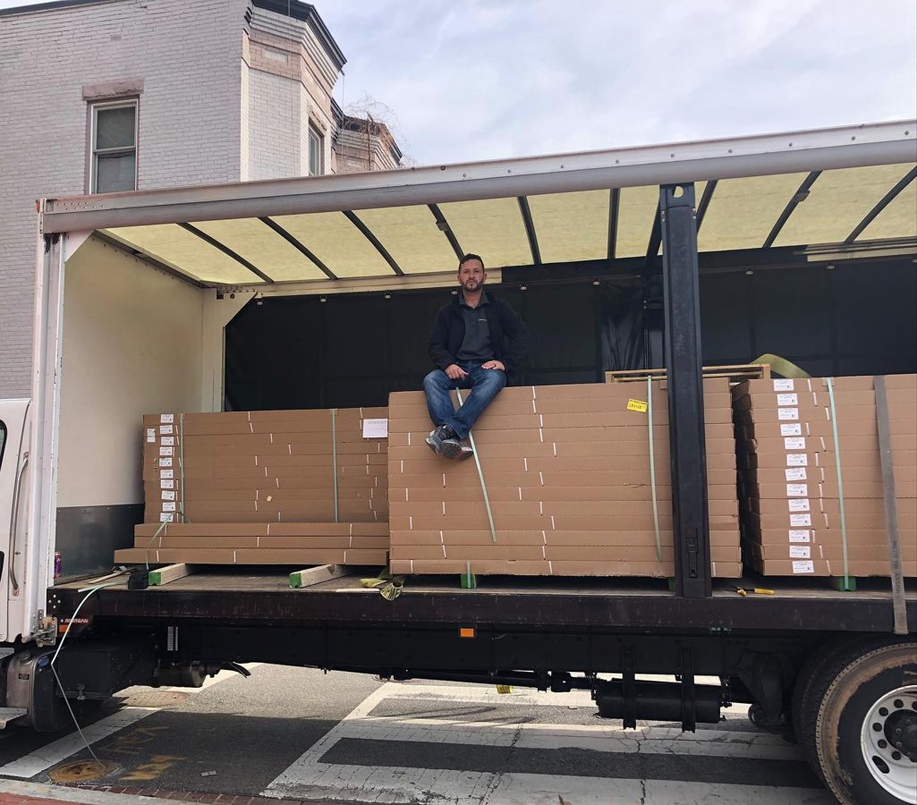 Owner of MD Flooring Solutions coordinating flooring material delivery